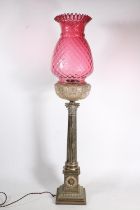 Victorian silver plated Corinthian column oil lamp base, the cranberry glass shade over clear cut