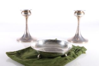 Pair of hallmarked silver weighted candlesticks of tapering form on circular bases, Birmingham 1947,