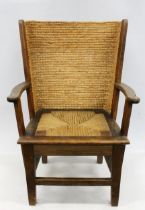 Early 20th century oak framed Orkney chair, the woven back with scrolled arms and drop in woven seat