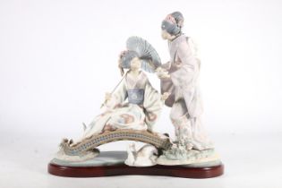 Lladro figurine, 'Springtime in Japan', of two Geishas on wooden footbridge, with original box,