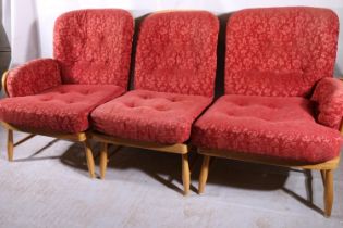 Ercol Jubilee range modular sofa, c1960s, the three beech framed individual chairs together as