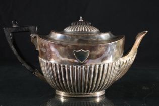 Victorian silver teapot, ebonized finial and angular handle on half lobed body, William Hutton and