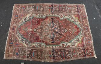 Serapi carpet rug, decorated throughout with floral and foliate designs, the madder field within