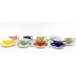 Nine Aynsley Bone China cabinet cups and saucers, of harlequin colours with fruit and floral