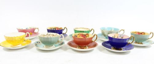 Nine Aynsley Bone China cabinet cups and saucers, of harlequin colours with fruit and floral