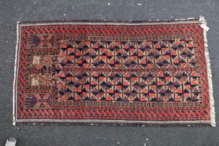 Baluch Persian/Afghan rug, the geometric stylised Tree of Life central pattern within multiple