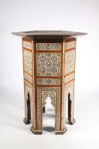 Syrian occasional table of Moorish design, early 20th century, the hexagonal wooden frame heavily