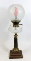 Victorian brass and metal oil lamp, of tapering fluted column form on stepped base, clear glass