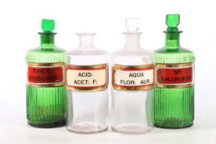 Four glass apothecary chemists' bottles, early to mid-20th century, the moulded bodies with inset