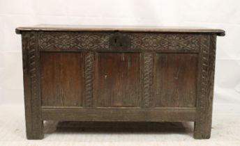 18th century oak coffer, the plain hinged plank top over three plain panels to the front within