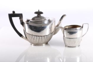 Victorian silver teapot and matching sugar bowl, the teapot with half lobed body with ebony finial