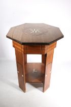 Arts &  Crafts teak occasional table in the manner of Liberty and Co., c1910, the octagonal hinged