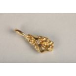 Unhallmarked gold nugget style pendant set with small round diamond, makers mark rubbed possibly '