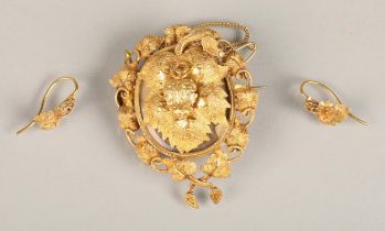 Victorian yellow metal leaf form locket pendant brooch and matching earrings (test as gold), the
