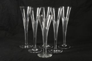 Set of four Victorian glass champagne flutes, mid to late 19th century, of flared trumpet form