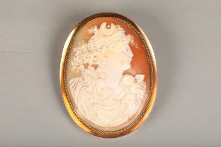 Victorian 9ct gold framed shall cameo brooch, the shell carved in relief with depiction of Diana