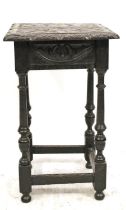 Antique oak occasional table, the carved square top over decorative frieze, raised on four turned