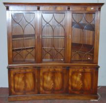 Mahogany bookcase/display cabinet, probably by Bevan-Funnell, with three concave astragal doors