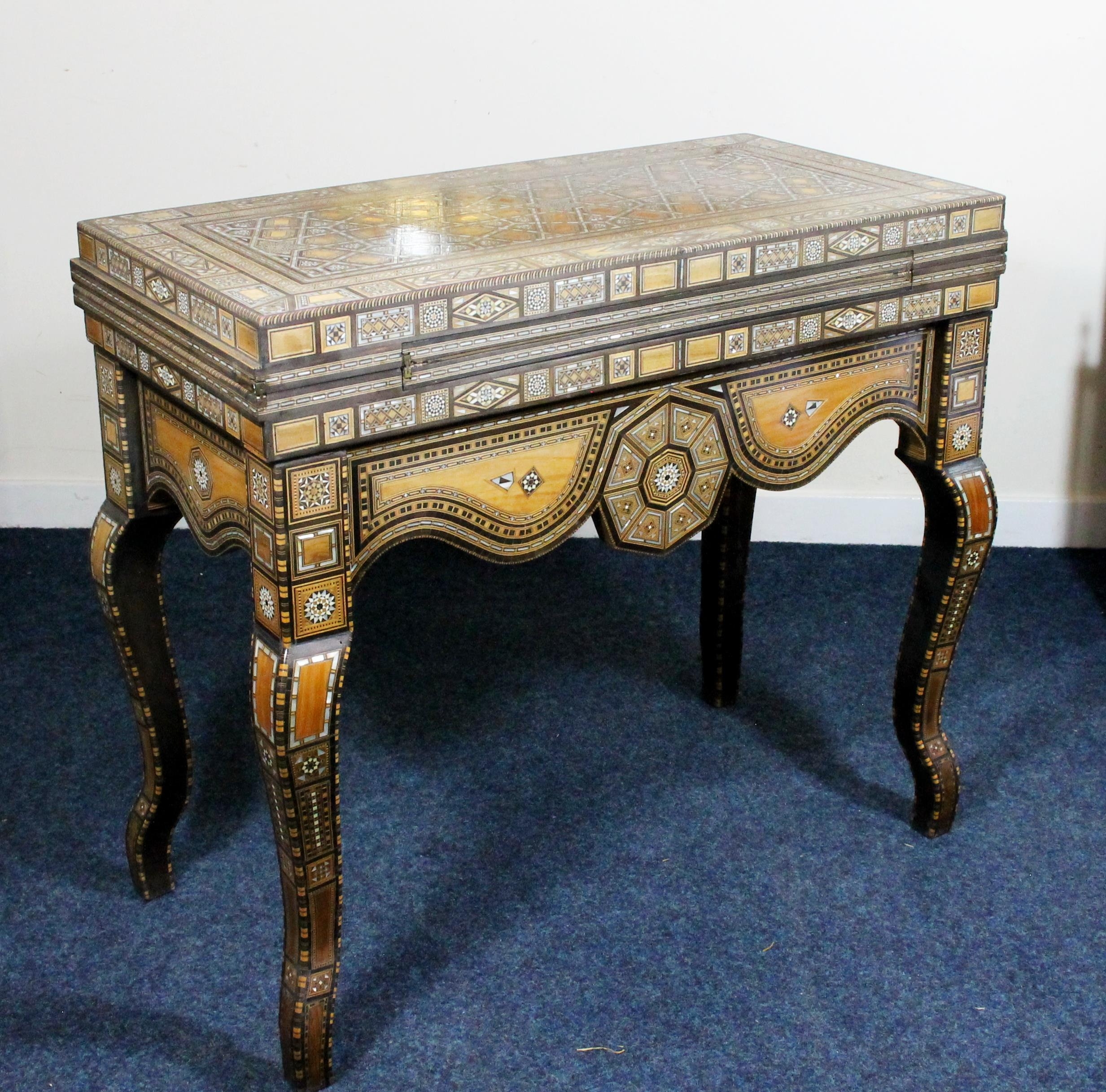 Syrian folding games table of Moorish design, mid 20th century, the elaborately inlaid mother of