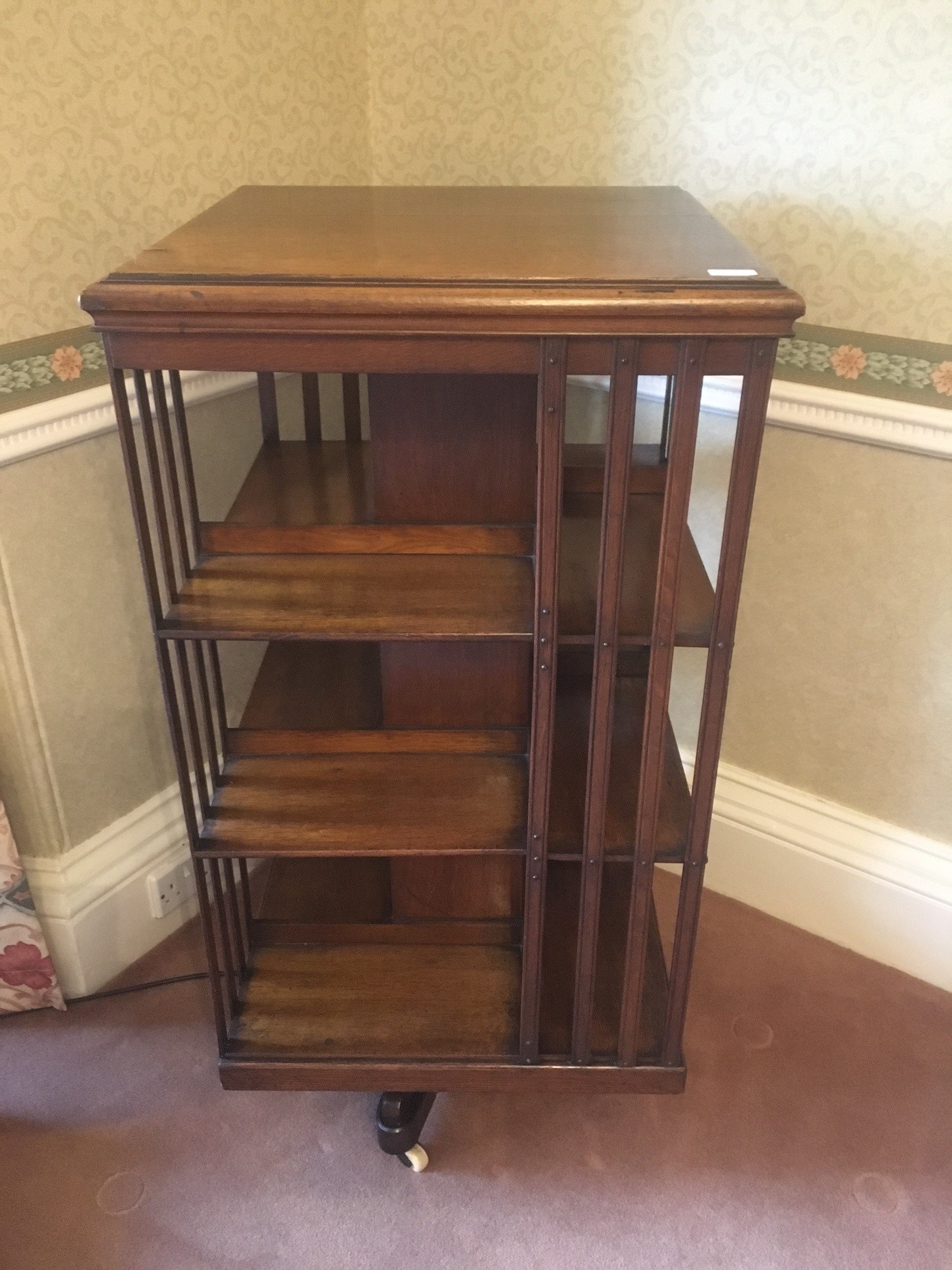 Early 20th century oak revolving bookcase of typical form, 114cm tall.