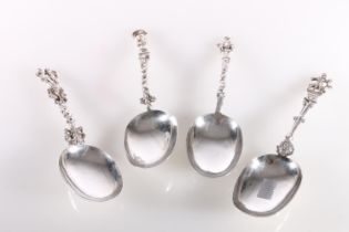 Four silver presentation rat tailed spoons with shaped handles and figural terminals, Marshall and