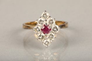 18ct yellow gold ruby and diamond ring, the central ruby encircled by eight 0.1cts diamond