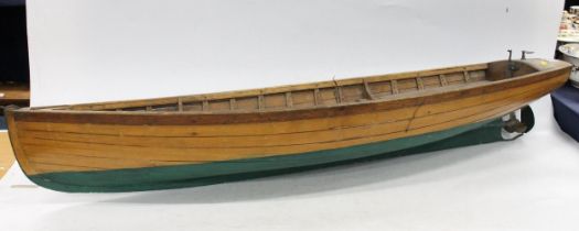 Mid 20th century model of a boat, the panelled hull with propeller and small motor, L108cm.