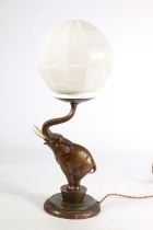 An Art Deco patinated spelter lamp base, c1930s, in the form of a circus elephant on stepped base