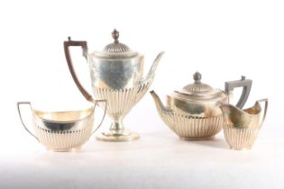 Victorian four-piece silver tea and coffee service, of half fluted tapering form with ebony