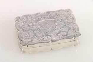 Edward VII silver snuff box of rectangular form with shaped edges, the body engraved with scrolled