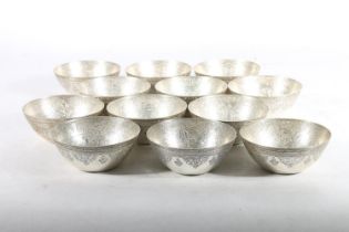 Set of twelve Egyptian silver bowls, c1920s, the bowls finely chase engraved with Arabic
