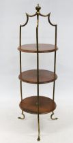 Early 20th century Art Deco style three tier cake stand, the round mahogany shelves within shaped