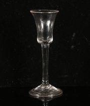 George II wine glass, the waisted bell bowl over plain stem on a shallow conical folded foot, H17.