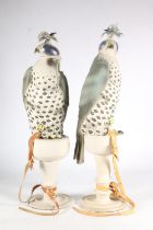 Pair of Scottish Helmsdale Pottery unglazed porcelain models of hooded falcons, the birds with