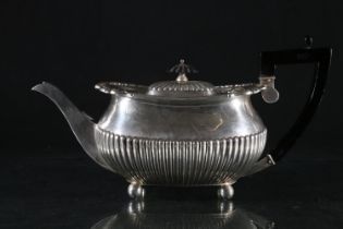 Victorian silver teapot, hinged half lobed lid with ebonized finial over a half lobed body,