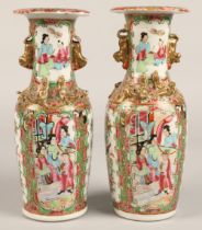 Pair of Canton vases, of baluster form, with panels of figures, birds, butterflies and flowers, with