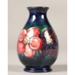 Moorcroft pottery vase in the clematis pattern, 13cm high.