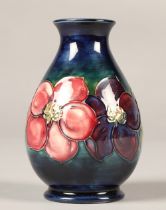 Moorcroft pottery vase in the clematis pattern, 13cm high.