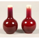 Sang De Boeuf, pair of red bottle shaped chinese vases, 10 cm high