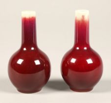 Sang De Boeuf, pair of red bottle shaped chinese vases, 10 cm high