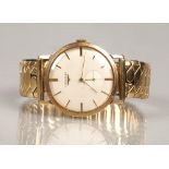 Longines 9ct gold wrist watch, champagne dial with baton hour markers with subsidiary dial. with