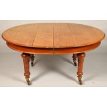 Victorian oak telescope table, eight matching chairs and carved oak sideboard.