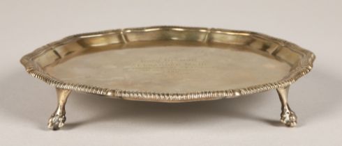 Silver salver raised on four feet with centre inscription, assay marked London 1917, maker Thomas