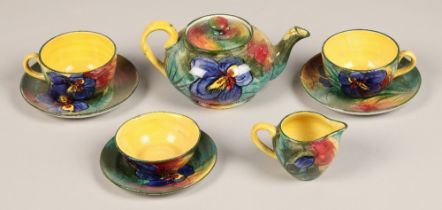 Wemyss 'Iris' pattern tete-a-tete tea set including tea pot, two cups and saucers, creamer, dish and
