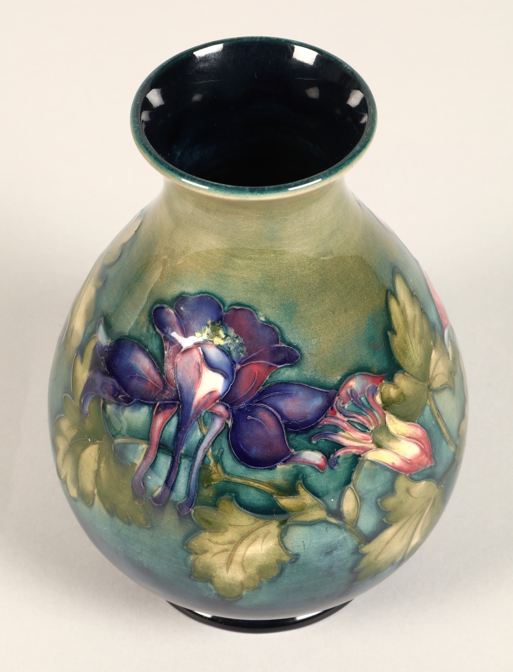 Moorcroft pottery vase of baluster form, green/blue ground in the clematis pattern, signed in blue - Image 5 of 13