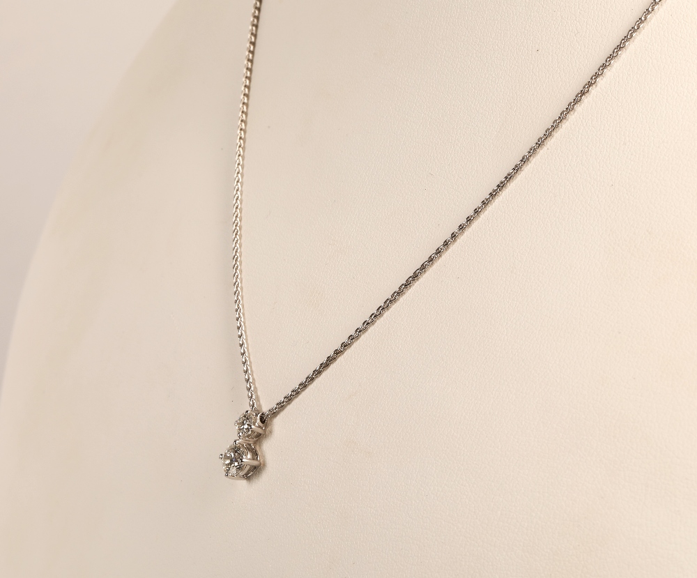 Ladies two stone diamond pendant mounted on an 18ct white gold chain. stone one 0.5 carat, stone two - Image 2 of 7