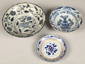 Two Chinese blue and white shallow bowls,and one blue and white saucer.