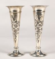 Pair of silver weighted spill vases, with embossed floral decoration, assay marked London 1906,maker