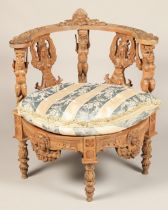 Heavily carved corner chair, with carved figure back panels panels, 72cm width, 78cm high.