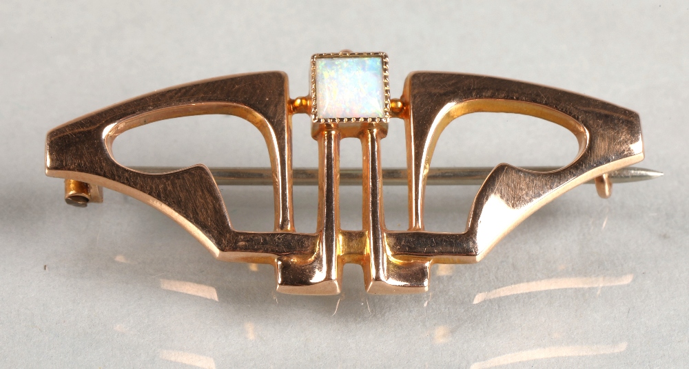 Murrle Bennett 9ct gold bar brooch set with an opal, 2.2 grams.